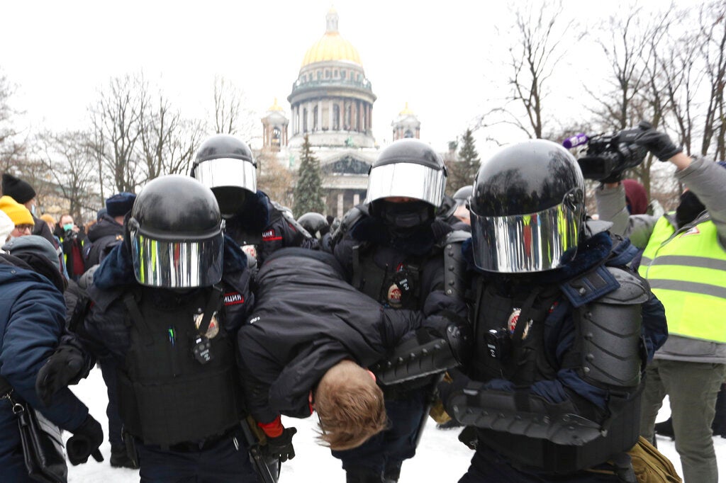 Police officers detain a protester during a rally in support of Alexei Navalny in St. Petersburg, Russia, on January 23, 2021. 