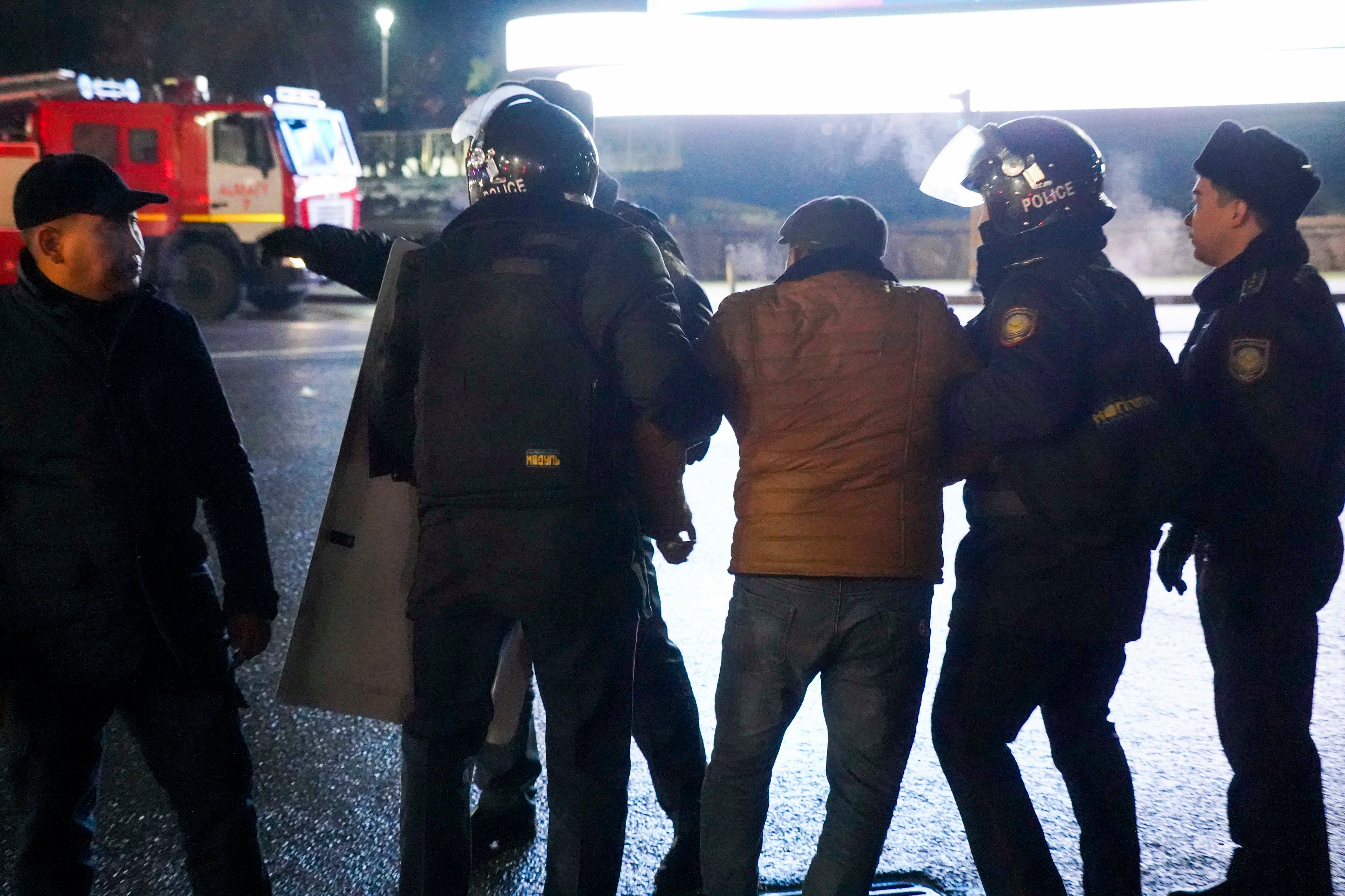 Police detain a protester in the center of Almaty, Kazakhstan, on Wednesday, Jan. 5, 2022.