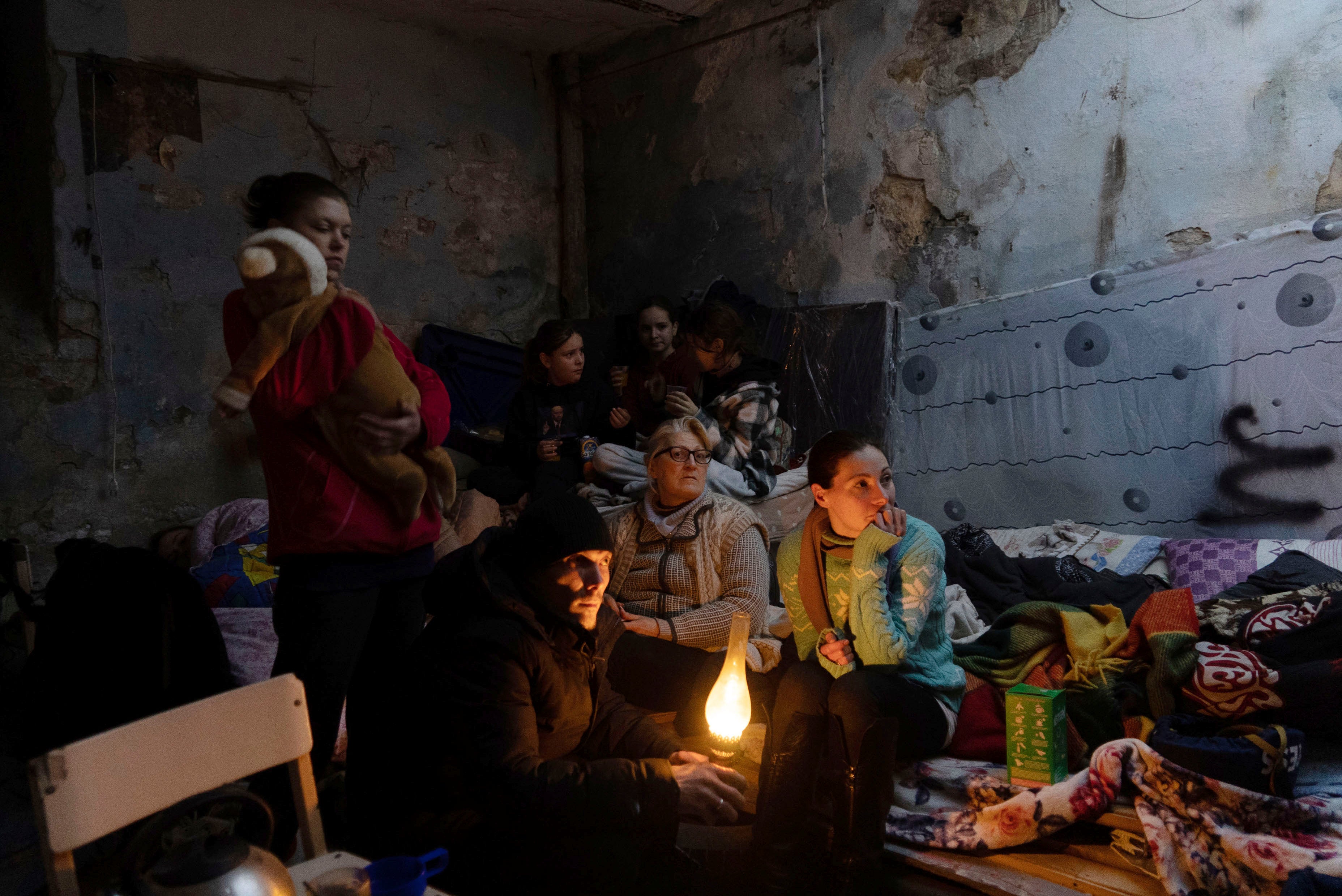 People settle in a bomb shelter