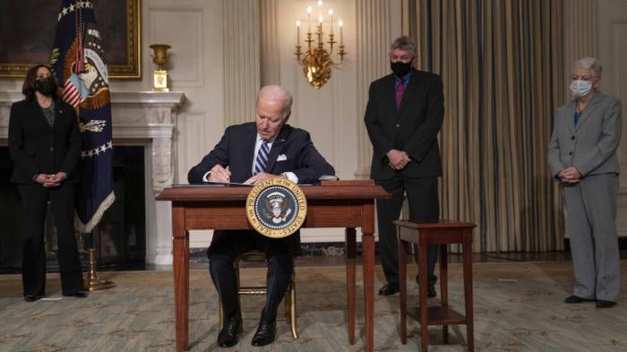 US President Joe Biden signs a series of executive orders on tackling climate change on January 27, 2021 in Washington, DC.