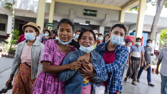 Women cry after seeing the body of their relative killed on March 14th by security forces during a peaceful protest in Yangon, Myanmar.