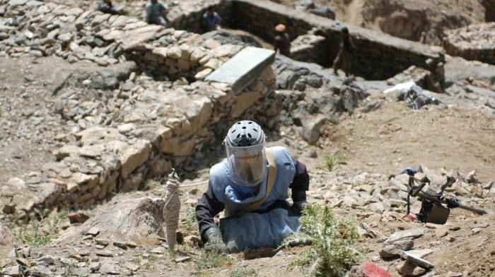 Clearance operator from the Halo Trust clearing a steep, rocky hillside in Afghanistan.