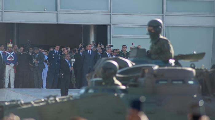 Brazil’s President Jair Bolsonaro watches a military parade in front of the presidential palace in Brasilia on August 10, 2021.