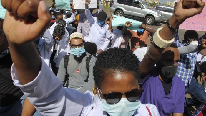 Medical workers protest to honor medical staff who have died from Covid-19, and to demand better protection and working conditions from the government, outside the Ministry of Health in Nairobi, Kenya, December 9, 2020. 