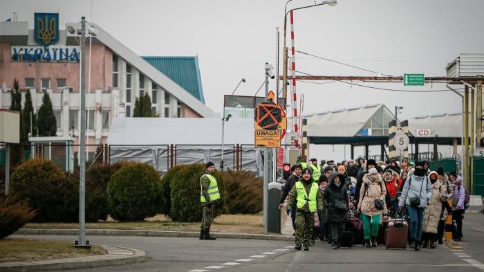People fleeing Ukraine enter Poland through the border crossing Korczowa, Poland, March 4, 2022.