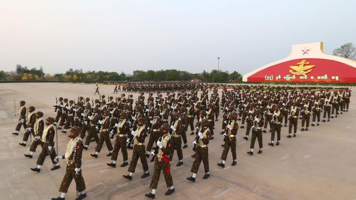 Myanmar military officers march during a parade