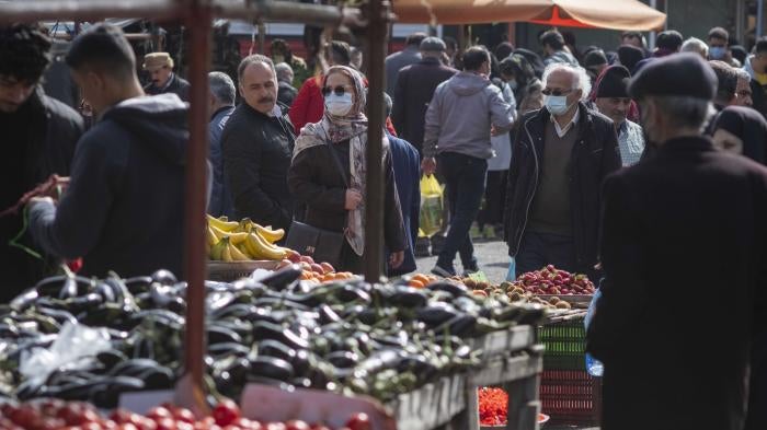 People shopping in the Basir Thursday Bazaar (Market) in the city of Astaneh-ye Ashrafiyeh in Gilan province on March 24, 2022.