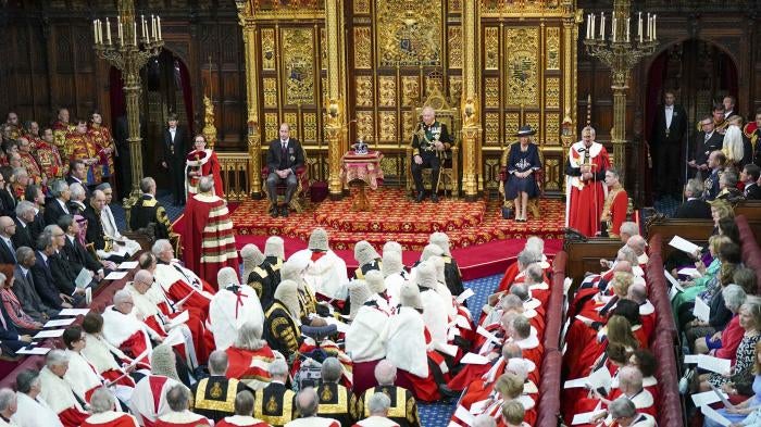 Prince Charles reads the Queen's speech next to her crown during the State Opening of Parliament, at the Palace of Westminster