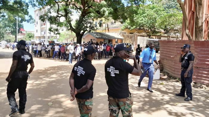 Security force members stand in a street ahead of the trial of eleven men accused of responsibility for the 2009 massacre and mass rape of pro-democracy protesters by forces linked to a former military junta in Conakry, Guinea, September 28, 2022.