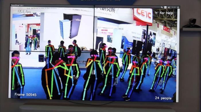 A display shows surveillance technology capable of analyzing body motion for specific actions like fighting, theft or fall during Security China 2018 in Beijing, China, Tuesday, Oct. 23, 2018. 
