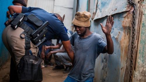 South African man being searched by police
