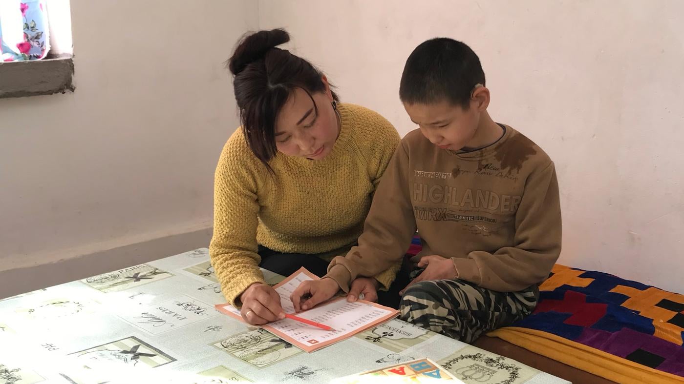 Mother and child working on homework together