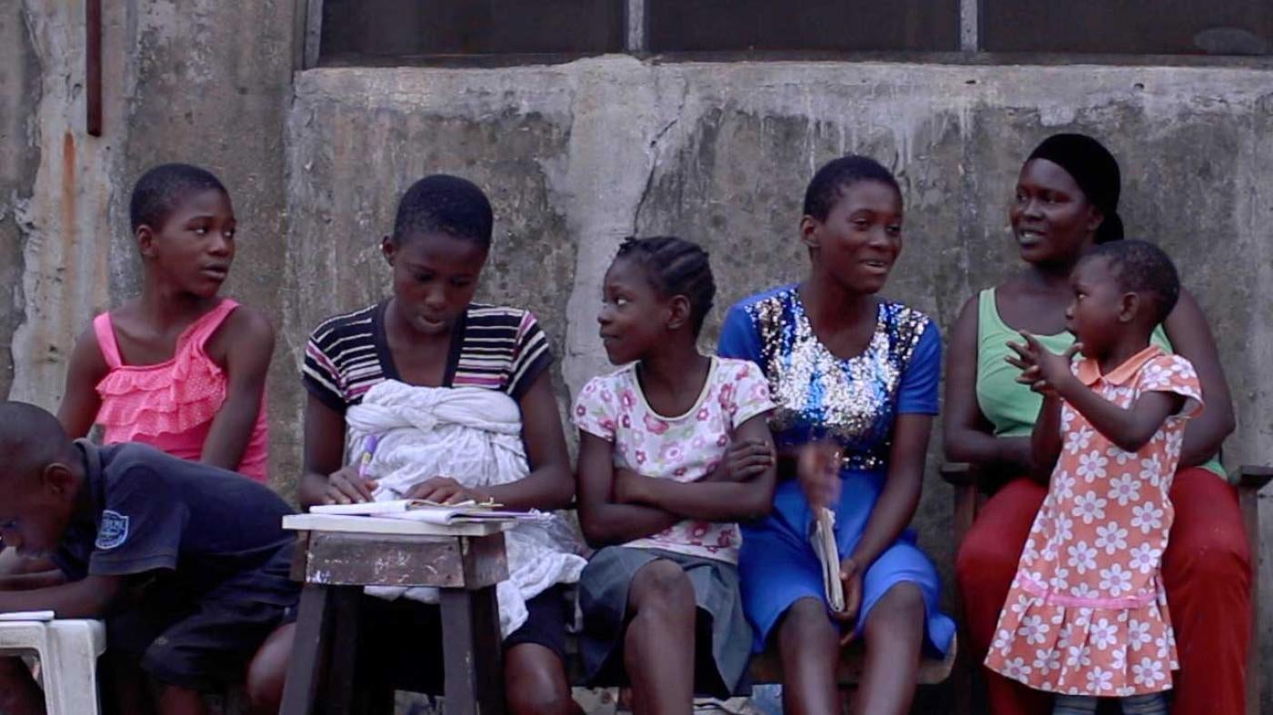 Margaret Okuomo with five of her children, in the waterside slum community of Ago Egun Bariga in Lagos, Nigeria. 