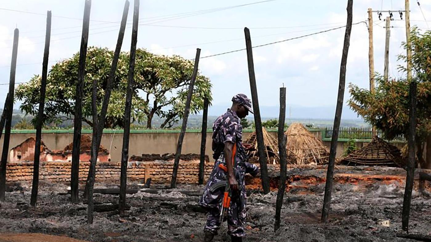 A Ugandan soldier guards the remains of the destroyed palace of Charles Wesley Mumbere, king of the Rwenzururu, after Uganda security forces stormed the compound in Kasese town, western Uganda on November 27. December 1, 2016.