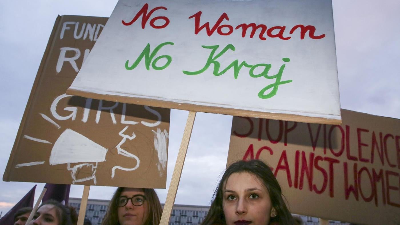Women’s rights supporters at a demonstration for International Women’s Day in Krakow, Poland, on March 8, 2018. The center sign uses the slogan “No Woman, No Country.”