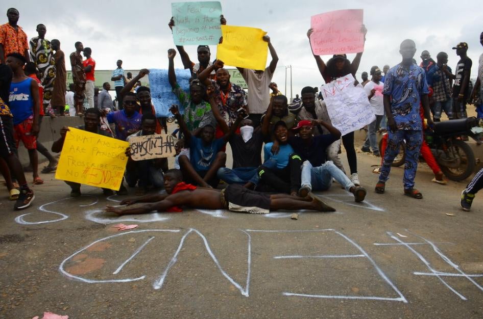 The Youths of End Sars Protesters gather in front of graffiti with description (END SARS) to barricade the Lagos - Ibadan expressway, the oldest highway and major link to all parts of the country, on October 16, 2020. 