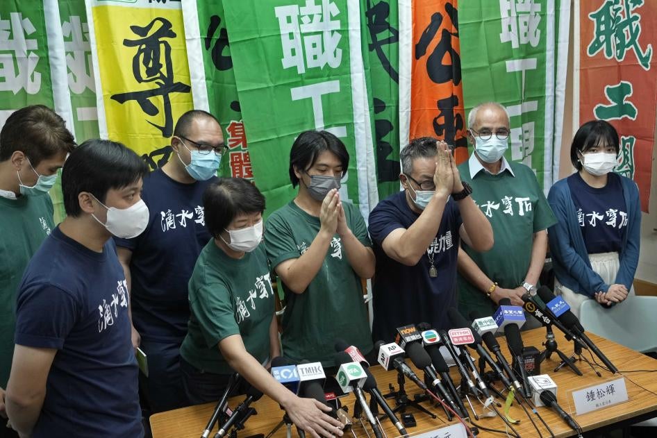 Hong Kong Confederation of Trade Unions President Joe Wong Nai-yuen, third from right, with other members before a news conference on the possibility of disbanding, Hong Kong