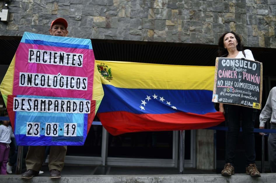 Cancer patients, survivors and their relatives protest against the lack of medicines and medical supplies in hospitals, in front of the headquarters of the Venezuelan Institute of Social Security (IVSS) in Caracas, on August 23, 2019.