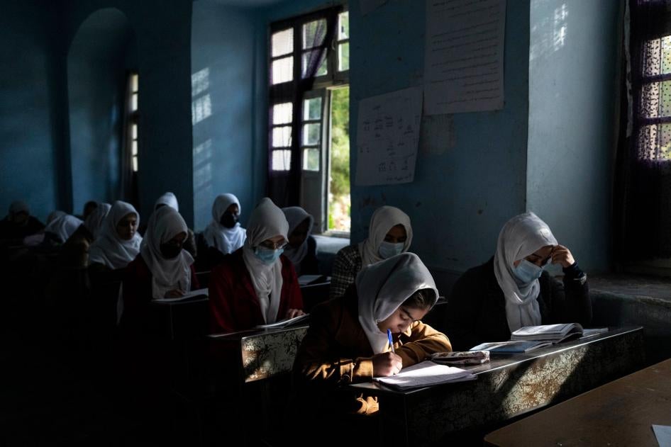 Afghan girls attend class at a high school in Herat, Afghanistan, November 25, 2021.