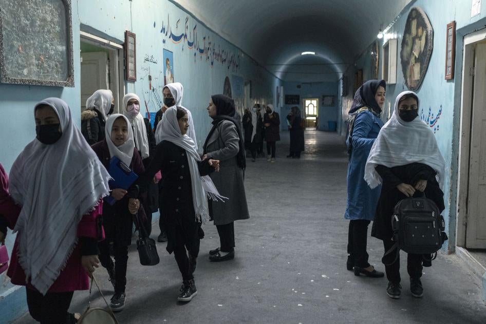 Afghan girls exit classrooms at Tajrobawai Girls High School in Herat, one of the few provinces where the Taliban permitted girls' secondary schools to reopen, November 25, 2021.