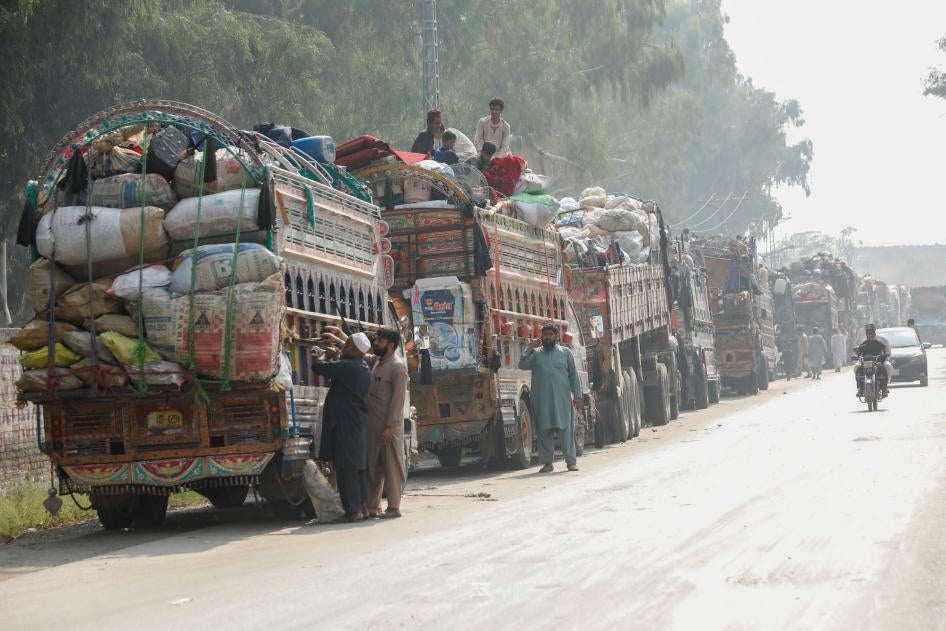 Trucks loaded with the belongings of Afghan refugees who are being forced to leave Pakistan outside the United Nations refugee agency repatriation centers in Azakhel town in Nowshera, Pakistan, October 30, 2023. 