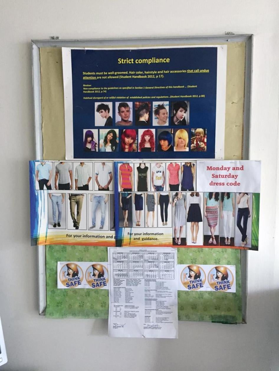 Uniform guidelines for students hang on a wall at a university in Manila, November 2016. 