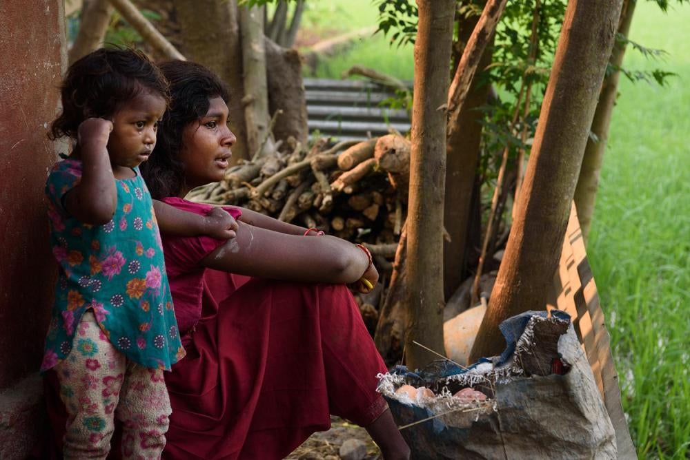 17-year-old Anjana M., married at 14, sits outside her home with her two-year-old daughter Ishita. Anjana’s aunt and uncle pressured her to marry her husband because of rumors about her relationship with him. Anjana’s father sent her to Pokhara when she w