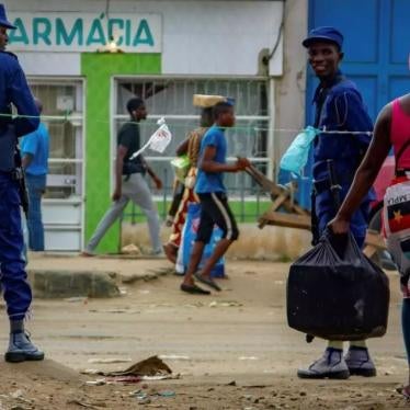 Angolan police patrol streets as people move about during the country's Covid-19 lockdown, Luanda, Angola, March 2020.