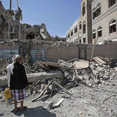 A man looks at damaged buildings after deadly airstrikes in Sanaa, Yemen, on May 7, 2018. 