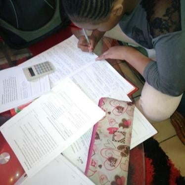 Keshia completes her homework in her family’s home in Johannesburg in August 2020. ©2020 Private
