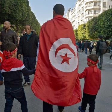 Tunisians take part in a rally marking the ninth anniversary of the 2011 uprising, at Habib Bourguiba Avenue in Tunis on January 14, 2020.