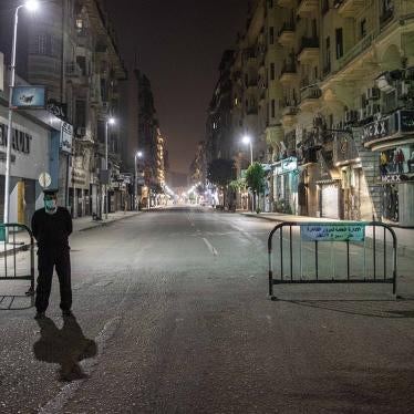 Egyptian security forces cordon off roads during curfew hours in Cairo, Egypt, Sunday, March 29, 2020