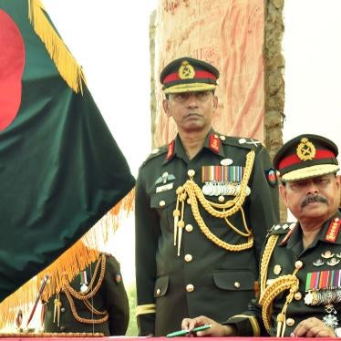 Army chief General Aziz Ahmed (R) looks on during a program in a refugee camp in Ukhia on November 24, 2019.