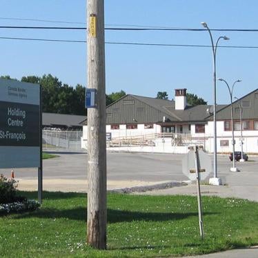 Entrance to the Canadian Border Security Agency's (CBSA) Laval Immigration Holding Centre in Quebec, Canada, showing a the entrance sign with the Canadian flag and the detention center in the background..
