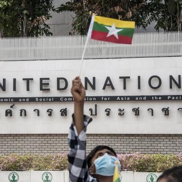 A protester waving a Myanmar nation flag in front of the United Nation building during the demonstration.