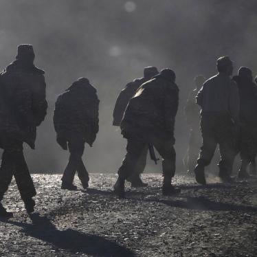 Ethnic Armenian soldiers walk along the road near the border between Nagorno-Karabakh and Armenia, Sunday, Nov. 8, 2020.