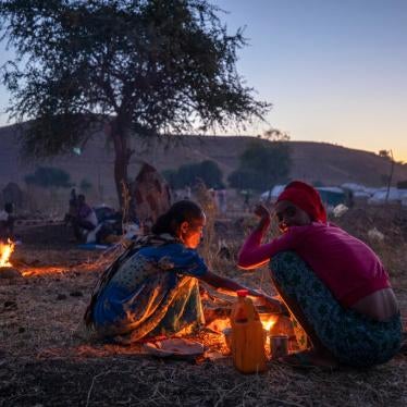 Tigrinyan refugee women prepare bread for their family in Umm Rakouba refugee camp in Qadarif, eastern Sudan on December 11, 2020 