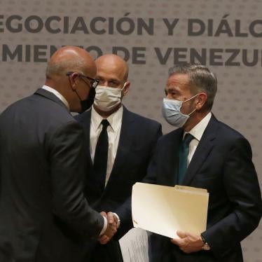 Jorge Rodriguez, left, representing the Maduro government, shakes hands with Venezuelan opposition delegate Gerardo Blyde Perez, in Mexico City, Friday, Aug. 13, 2021.