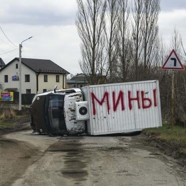 Destroyed vehicle in Bucha, Ukraine with the word “mines” in Russian, April 4, 2022.