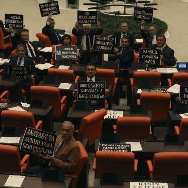 Opposition members of parliament hold up placards protesting the Erdoğan government’s proposed law to criminalize disinformation and tighten control over social media as an attempt to increase censorship in the run up to 2023 elections; October 11, 2022. 