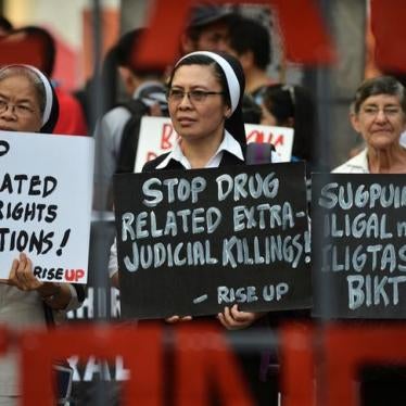 Catholic nuns hold placards as they protest against drug-related extrajudicial killings, on International Human Rights Day in Manila, Philippines, December 10, 2016.