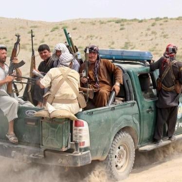 Afghan local police (ALP) sit at the back of a truck near a frontline during a battle with the Taliban at Qalay- i-zal district, in Kunduz province, Afghanistan August 1, 2015.