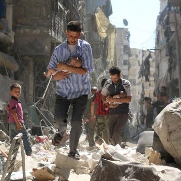 Men carrying babies make their way through the rubble of destroyed buildings after an airstrike on the rebel-held Salihin neighborhood of Syria’s northern city of Aleppo, September 2016.
