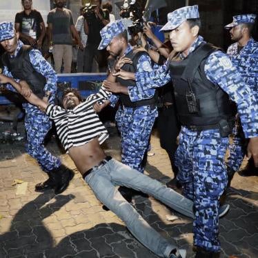 Police officers detain an opposition protester demanding the release of political prisoners during a demonstration in Malé, Maldives, February 2, 2018. 