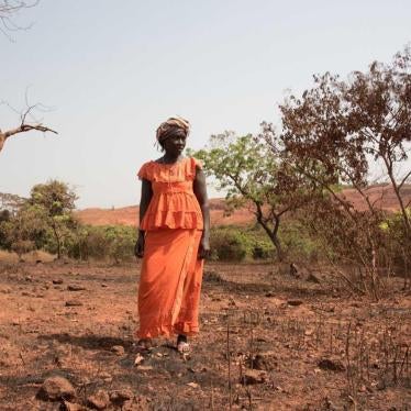A woman in Lansanayah, a village 750 meters from a bauxite mine owned by La Société Minière de Boké consortium.