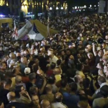 In this image from video, some thousands of protesters gather outside the parliament building in the Georgian capital of Tbilisi. 