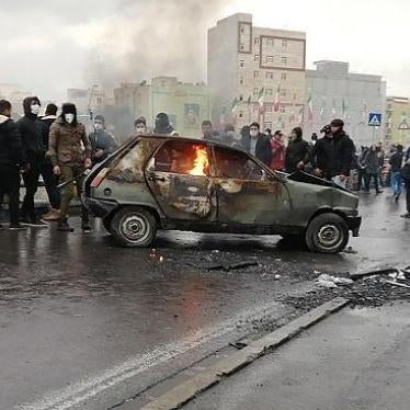 Iranian protesters gather around a burning car during a demonstration against an increase in gasoline prices in the capital Tehran, on November 16, 2019. 