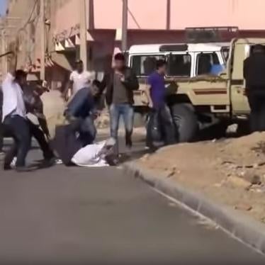 Screenshot of a video showing policemen severely beating two activists in Smara, Western Sahara, on June 7, 2019.