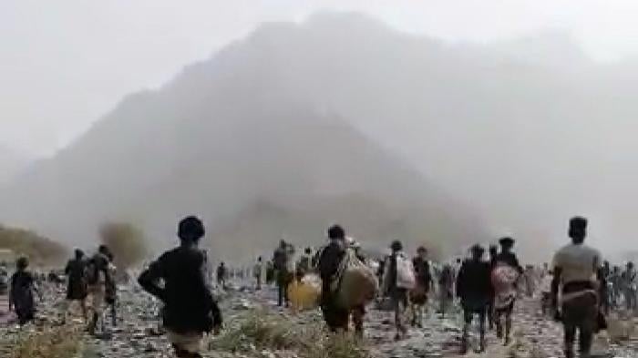 Migrants walking in mountains