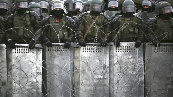 Belarusian police block a street during  opposition rally